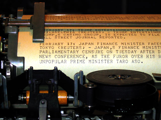 A news report in all upper case on the platen of a Model 15 Teletype